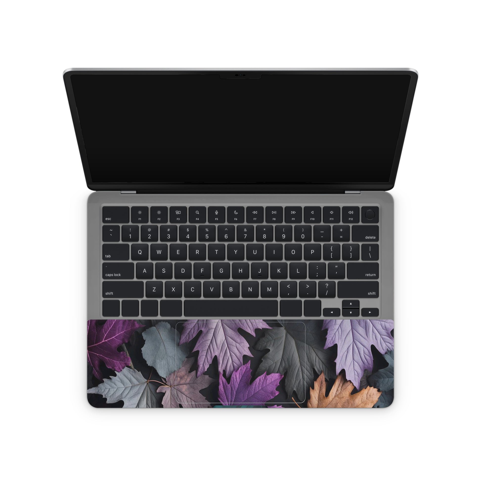 Laptop with a leaf patterned skin on a white background