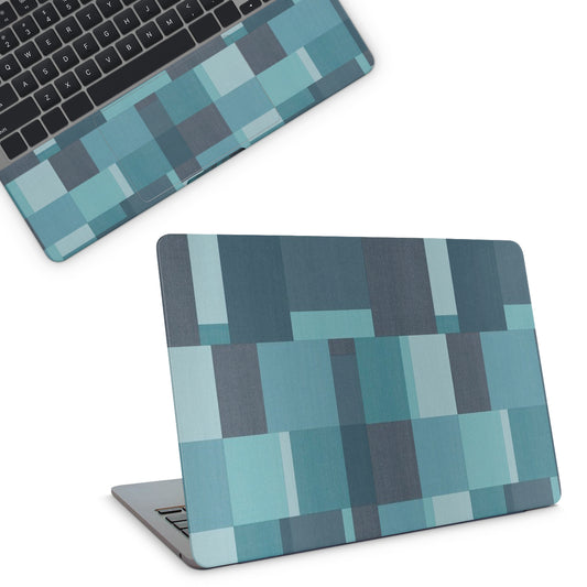 Laptop with a geometric blue and gray pattern on a white background