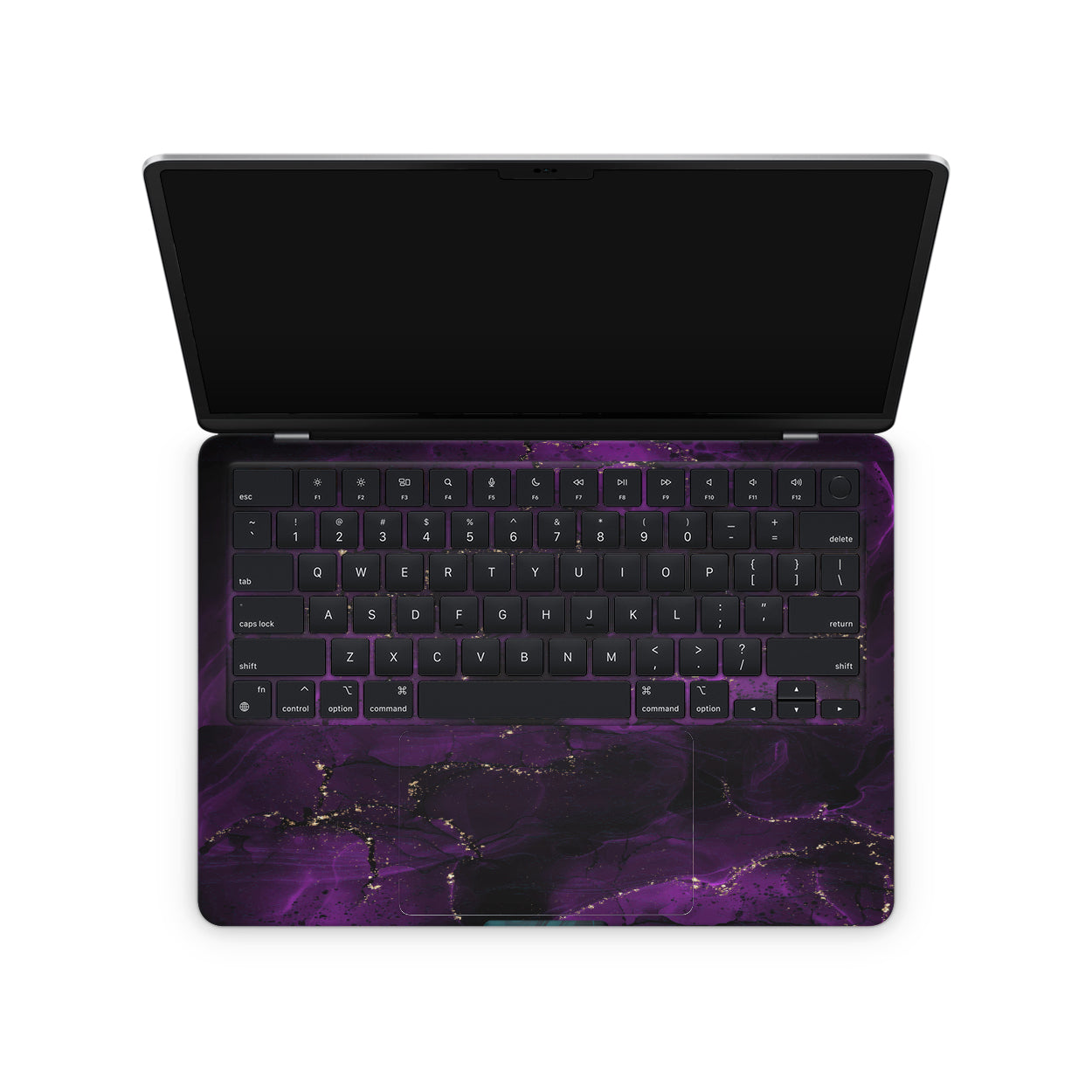 macbook skin with purple ink design on keyboard area