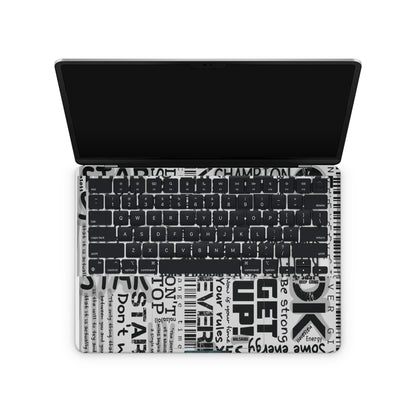 macbook skin with motivational text on keyboard area
