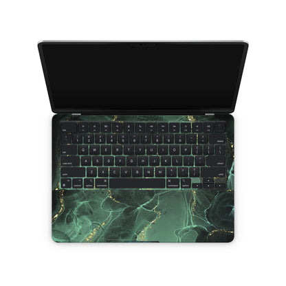 macbook skin with green ink design on keyboard area