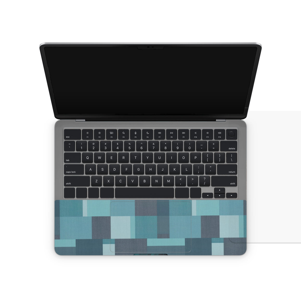 Laptop with a colorful geometric pattern on the bottom half of the lid.
