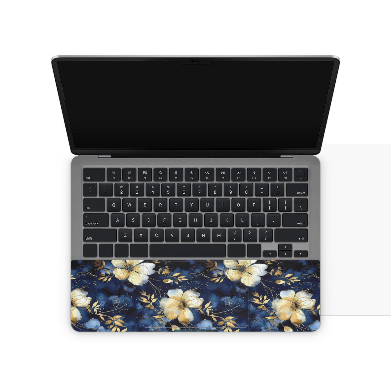 Laptop with a floral design on the base and a black screen
