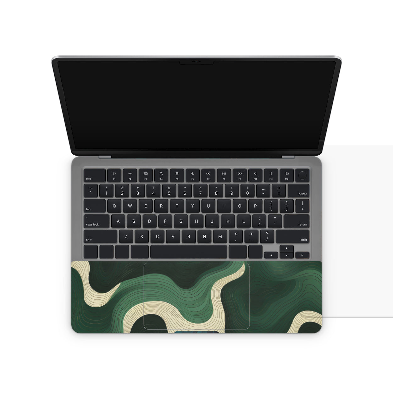 Laptop with a green and white abstract design on the keyboard area