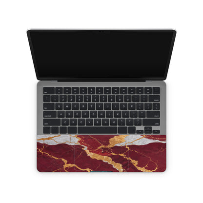 laptop skin with red marble texture design on touchpad area